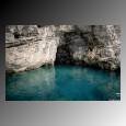 Blue green water in a grotto cave along the Amalfi Coast